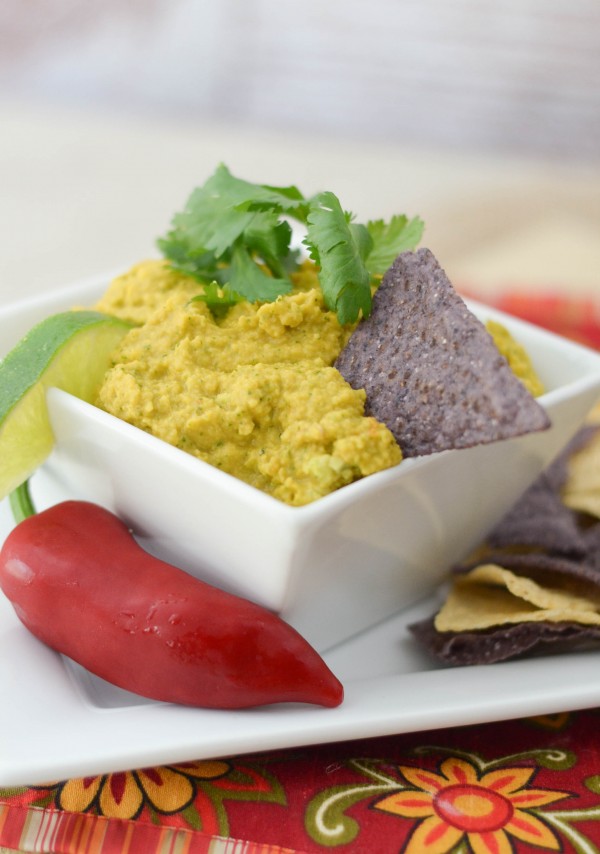 spicy guacamole dip plated with chips