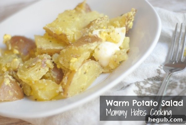 Close-up of freshly prepared warm potato salad with herbs