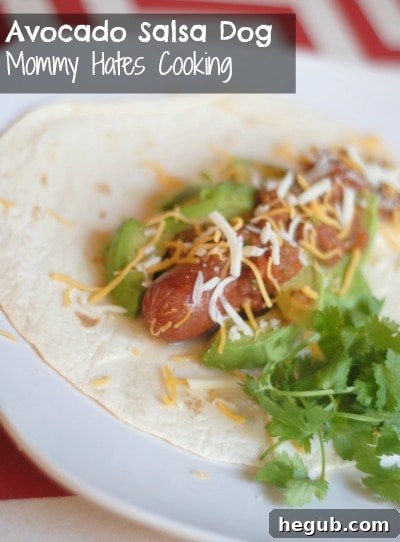 Delicious Avocado & Salsa Hot Dog, garnished with cilantro on a tortilla