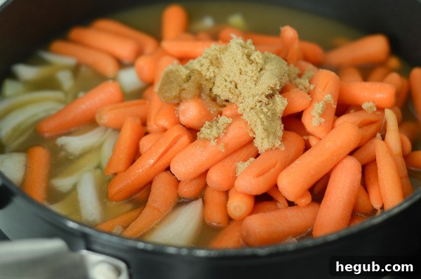 Fresh ingredients for making apple cider glazed carrots