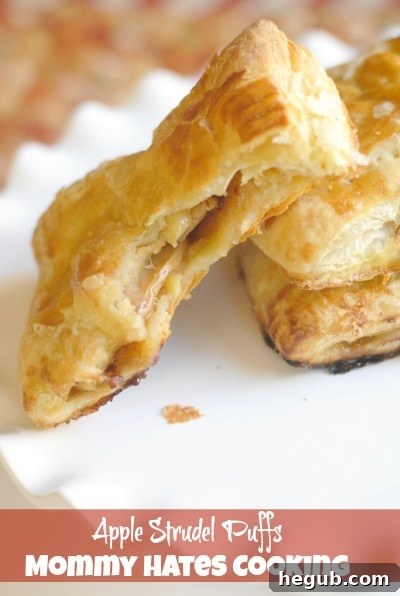 Golden brown apple strudel puffs on a baking sheet, ready to be served, perfect for an easy dessert.