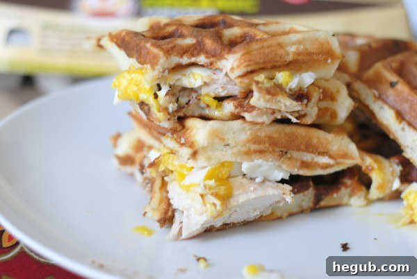 Close-up of Chicken and Waffle Sandwich with runny poached egg