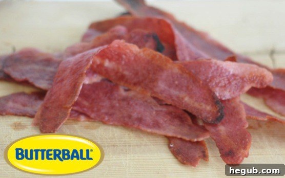 Crispy slices of cooked Butterball Turkey Bacon ready for a healthy salad