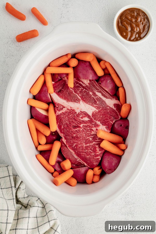 Tender 4-Ingredient Slow Cooker Roast Beef 4 Seared chuck roast with a golden-brown crust