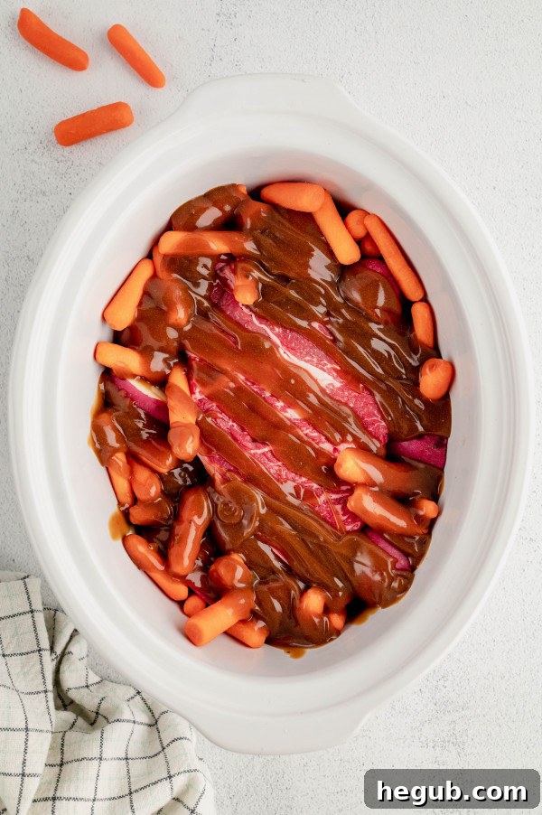Tender 4-Ingredient Slow Cooker Roast Beef 6 The four simple ingredients for slow cooker roast beef: beef, potatoes, carrots, gravy