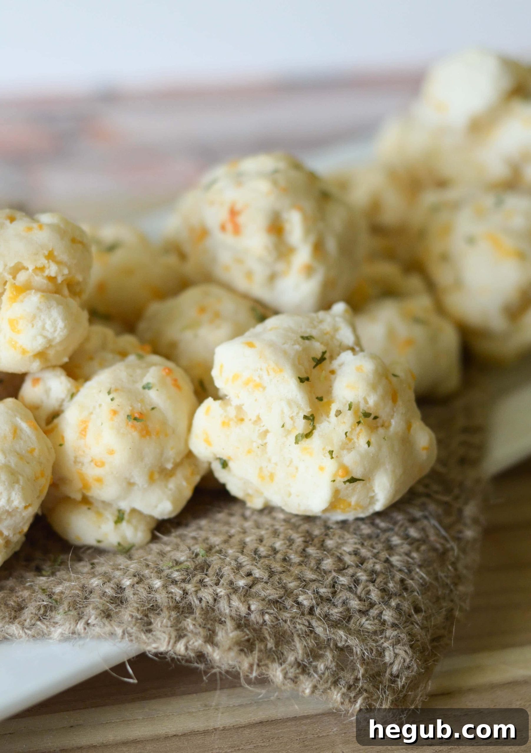 Homemade Gluten-Free Cheddar Bay Biscuits ready to be served on a white plate