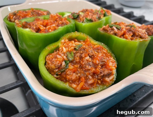 Stuffed peppers baking in a casserole dish