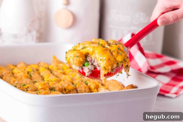 Prepared Tater Tot Casserole in a foil pan, ready for freezing