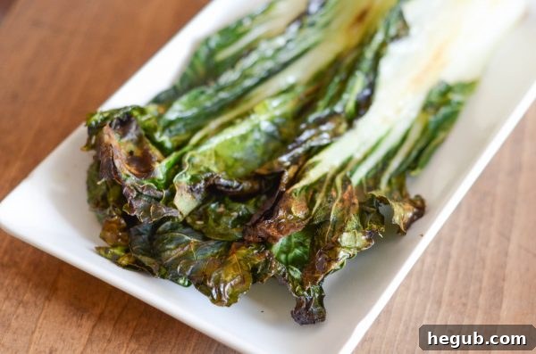 A vibrant platter of grilled bok choy, garnished with sesame seeds and fresh herbs, ready to be enjoyed.