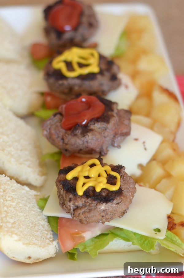 Table spread with Hawaiian Beef Sliders, condiments, and fresh ingredients