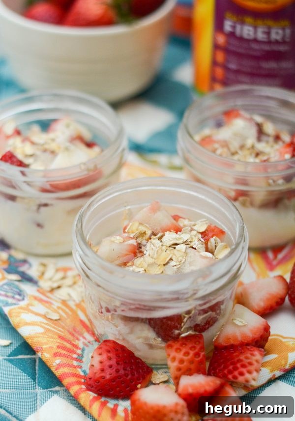 Unblended strawberry smoothie ingredients with Meta in a mason jar, ready for blending