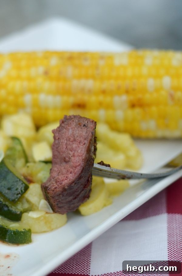 A perfectly seared steak with a glossy honey glaze and fresh herbs