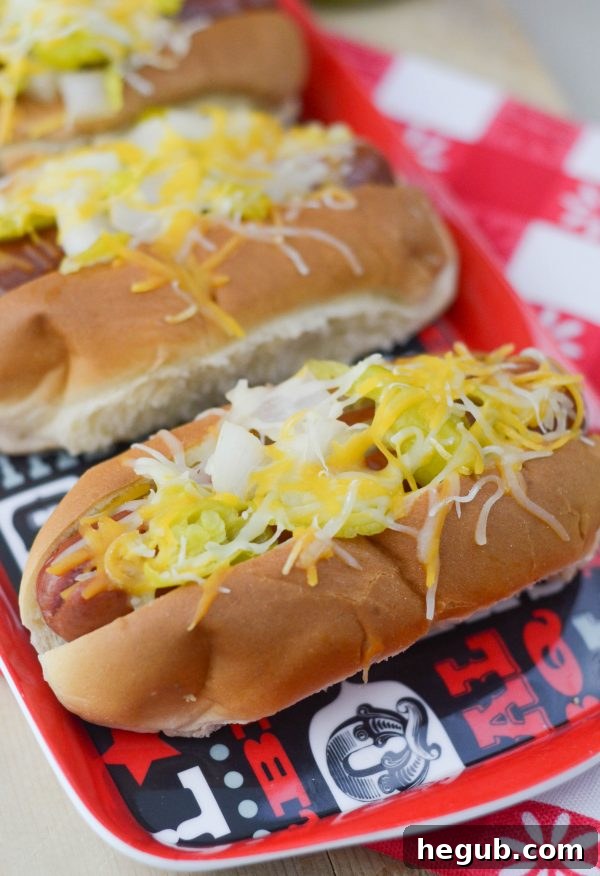 Spicy Stuffed Brats sizzling on the grill, bursting with flavor and perfectly charred for a robust summer meal. This image highlights a delicious, gourmet twist on traditional grilled sausages.