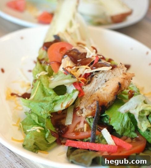 A refreshing Grilled Barbecue Chicken Salad, featuring perfectly grilled chicken, crisp greens, and a savory dressing. This image highlights a healthy and light grilled meal option for summer.