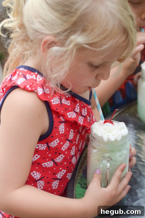A spread of several Mint Chocolate Floats, perfectly prepared and garnished, awaiting family members to gather and enjoy a delightful summer dessert experience.