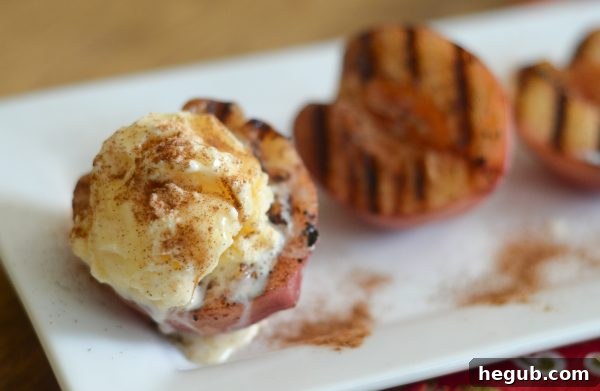 Delicious grilled cinnamon butter peaches, caramelized and ready to serve.