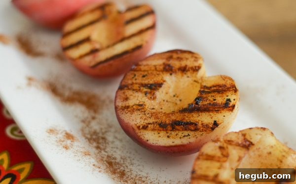 Freshly cut peaches ready for grilling, coated in cinnamon butter.