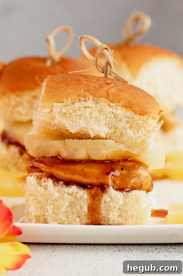 A serving of Hawaiian Chicken Sliders on a plate, showcasing their delicious appeal.
