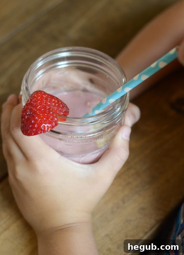 A fresh glass of Strawberry Banana Oat Smoothie with a blend of berries, banana, and oats, perfect for any time of day.