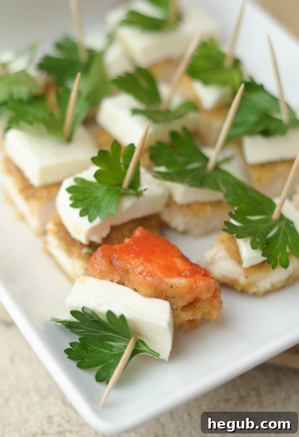 Delicious Holiday Appetizer: Parmesan Herb Bites, crafted with Tyson Chicken Strips, a stress-free party snack for festive gatherings.