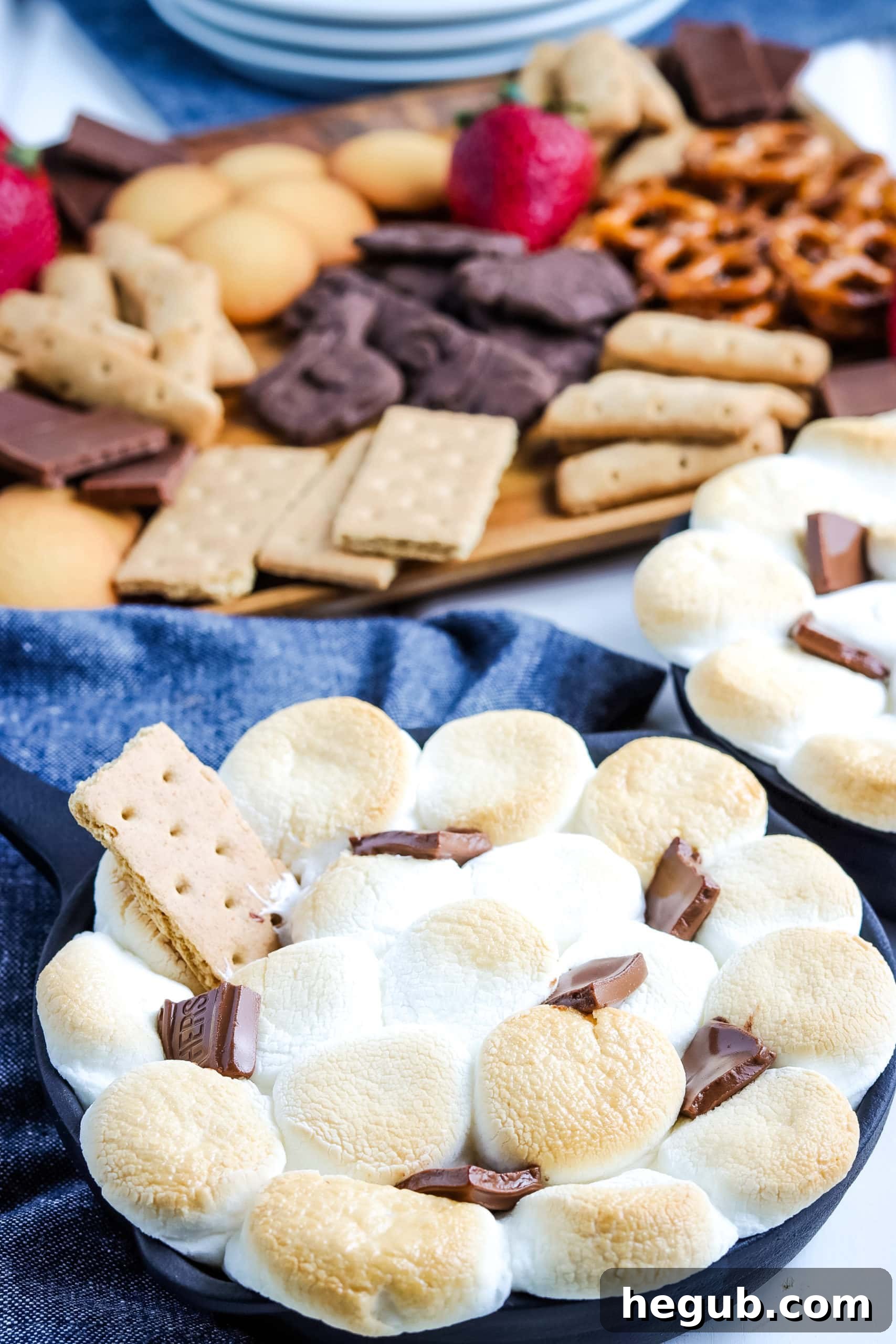Warm and gooey Easy S'mores Dip, a fun outdoor dessert