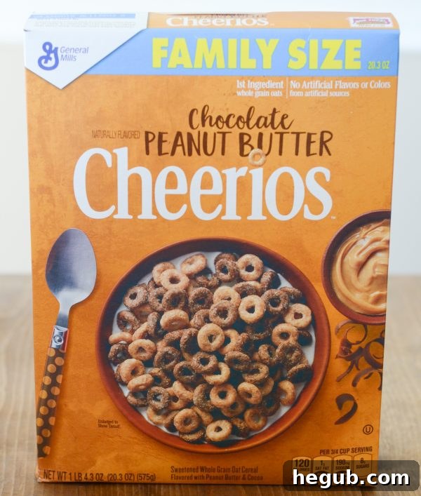 A box of Maple Cheerios and Chocolate Peanut Butter Cheerios in a well-stocked pantry.
