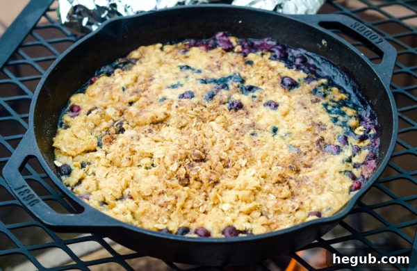 Preparing Campfire Blueberry Crisp ingredients in an outdoor setting