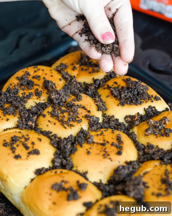 Ingredients laid out for Spooky Graveyard Rolls, including King's Hawaiian rolls, cookies, and candy