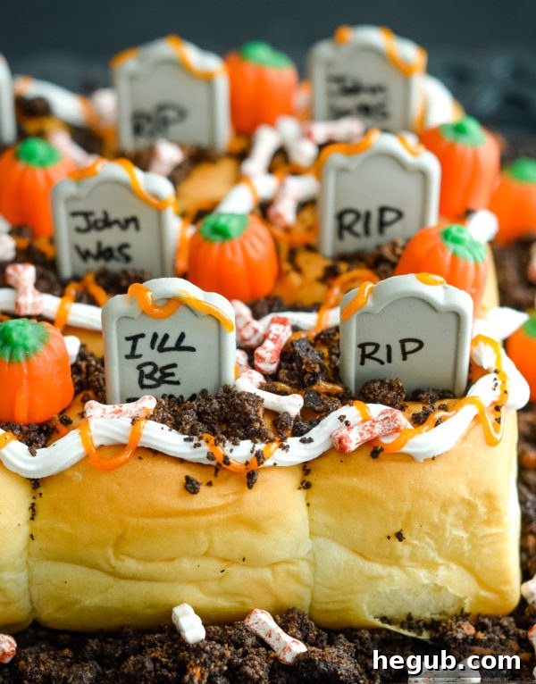 Decorating Spooky Graveyard Rolls with orange and white icing