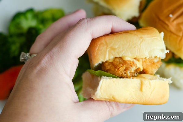 Plate of crispy chicken sliders with a drink