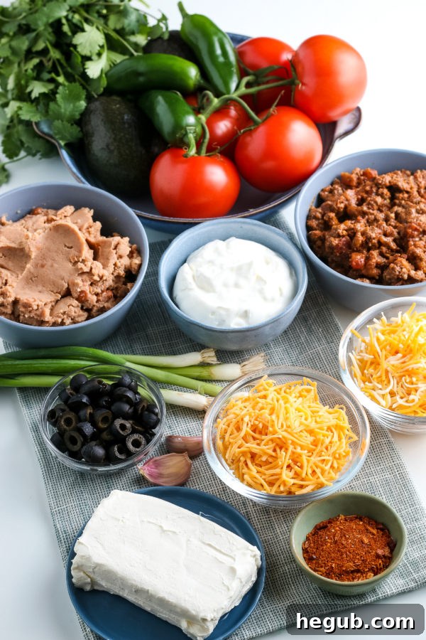 All the fresh ingredients laid out for making Layered Taco Dip