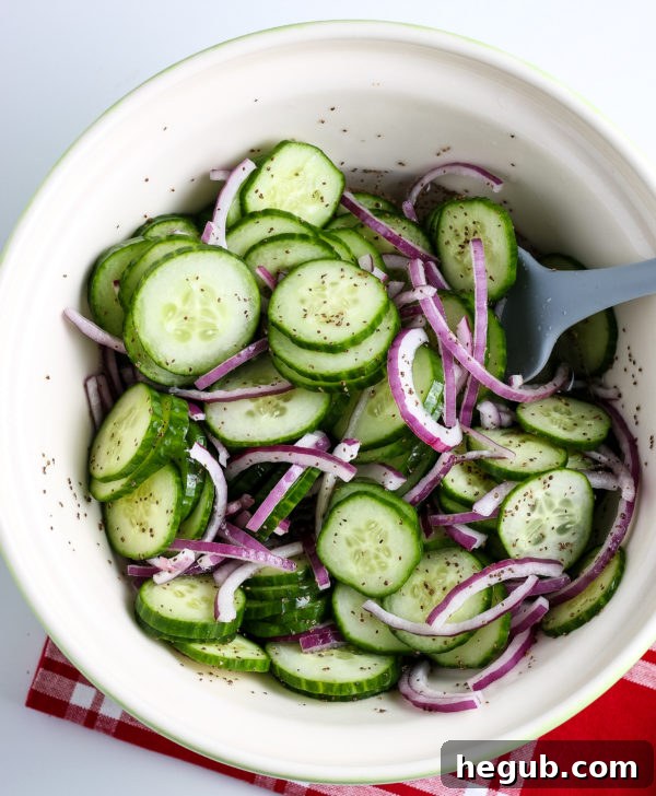 Preparing an easy cucumber salad with thinly sliced vegetables