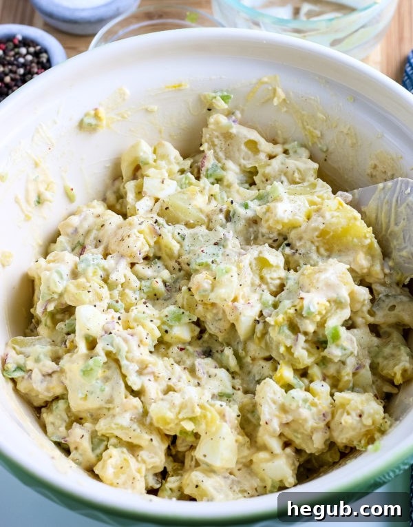 This image is mixing the finished potato salad.