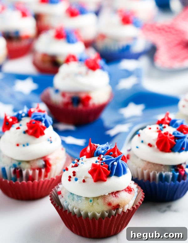 Gluten-Free Mini Patriotic Cupcakes adorned with red, white, and blue frosting and sprinkles, perfect for the 4th of July celebration.