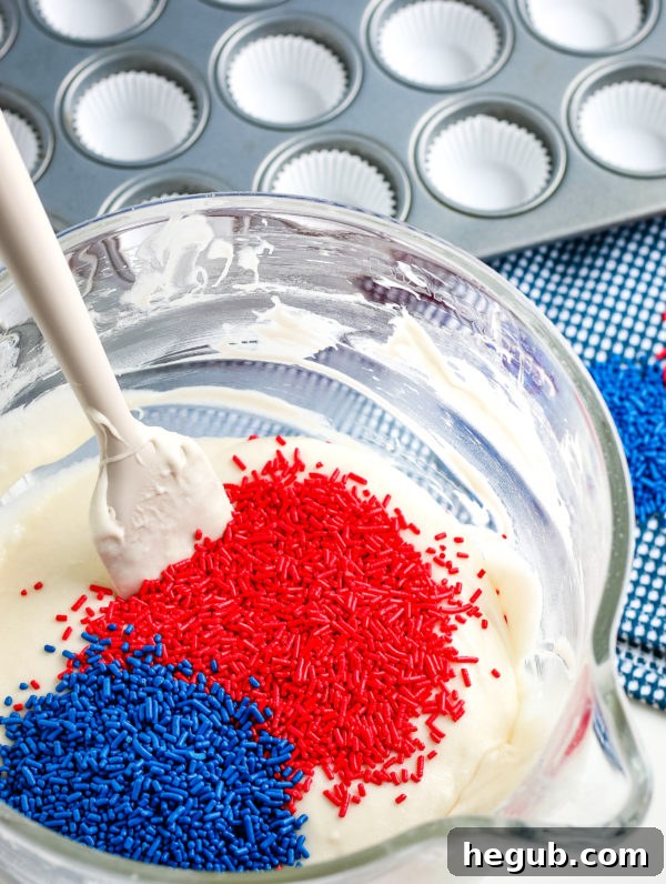 Gluten-Free Mini Patriotic Cupcakes batter with sprinkles, being prepared for baking.