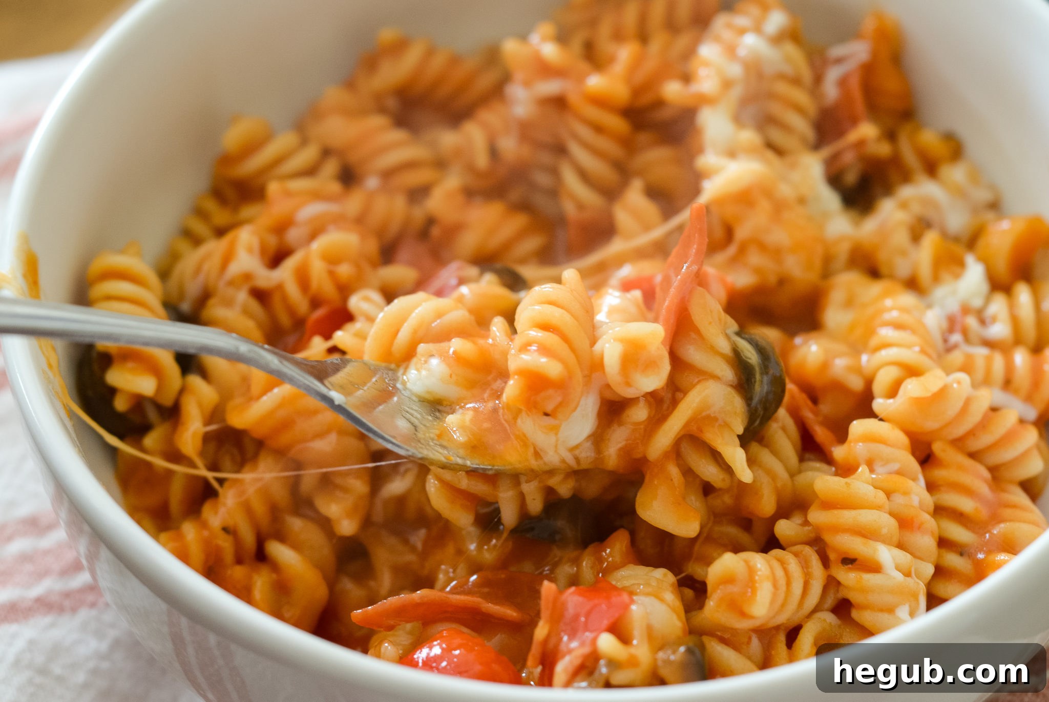 Weekly Menu Plan for August 16th 3 Ninja Foodi Pizza Pasta in a bowl, illustrating a quick and easy weeknight meal option