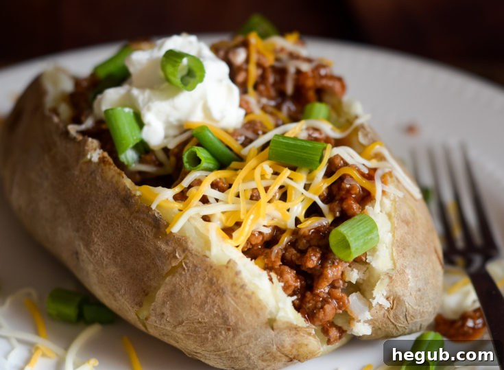 Sloppy Joe Potatoes served in a bowl with a fork.