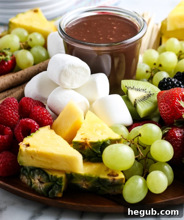 Hot Fudge Sauce drizzled over fruit and ice cream