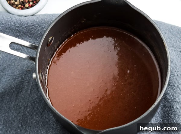 Close-up of freshly made hoisin sauce in a small bowl, showcasing its rich texture.
