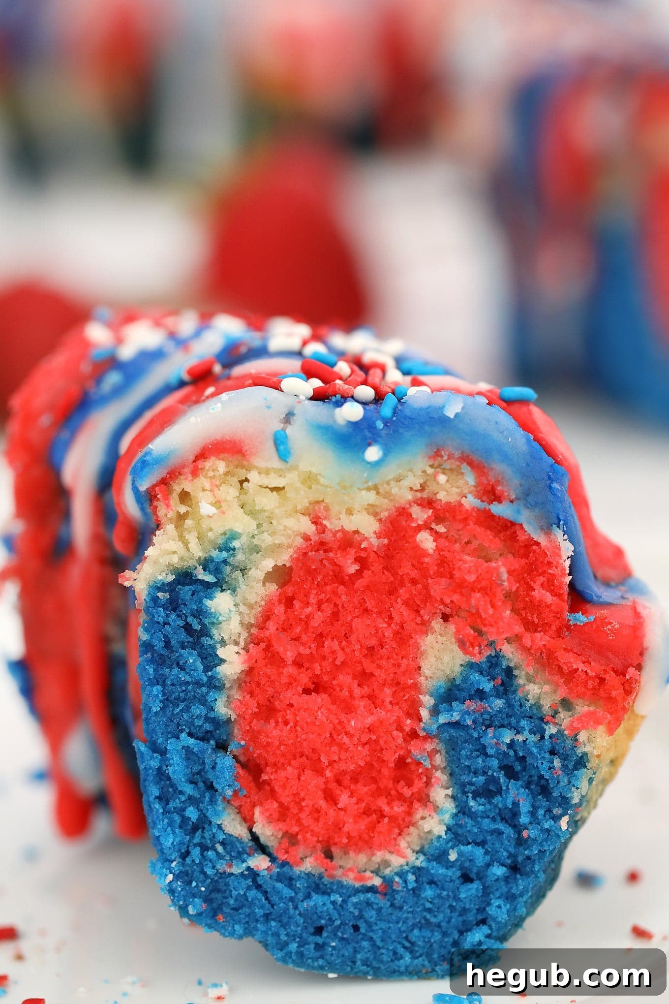Beautifully decorated Patriotic Bundt Cake with glaze and berries