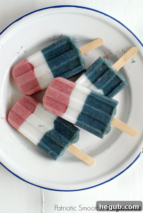 Patriotic Smoothie Popsicles with layered fruit and yogurt