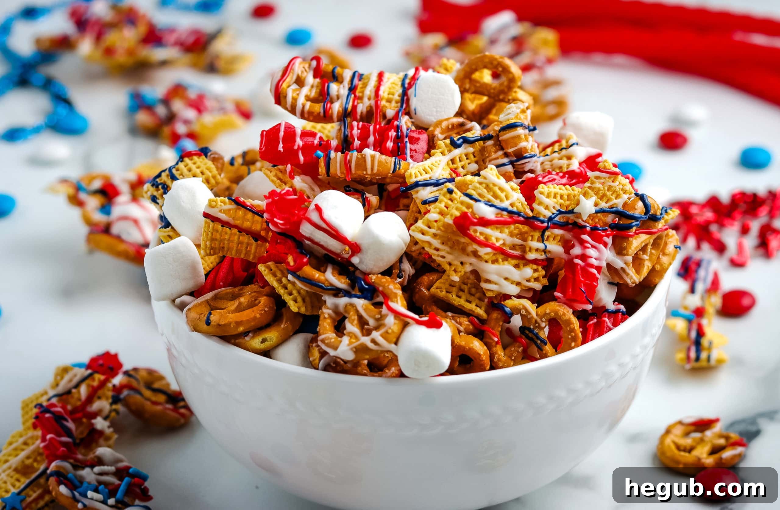 Patriotic Chex Mix with red, white, and blue candies and sprinkles