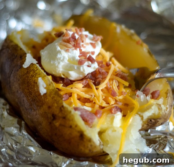 Smoked baked potatoes with various toppings