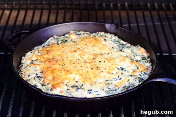 Pellet Grill Sides: The Ultimate Smoked Accompaniments 4 Delicious smoked spinach dip cooking on a pellet grill.
