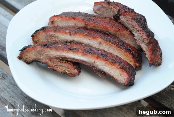 Delicious brown sugar glazed ribs, perfectly smoked and ready to eat, symbolizing the start of barbecue season.