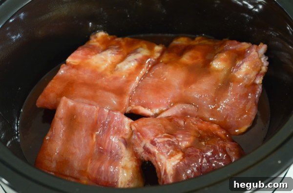 This image shows baby back ribs in the slow cooker.