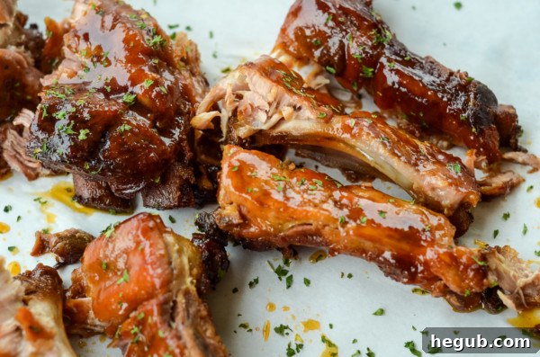 This image shows sliced and ready to eat apple bbq ribs made in the slow cooker.