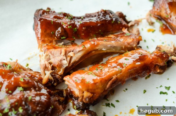 This image shows baby back ribs made into slow cooker apple bbq ribs.
