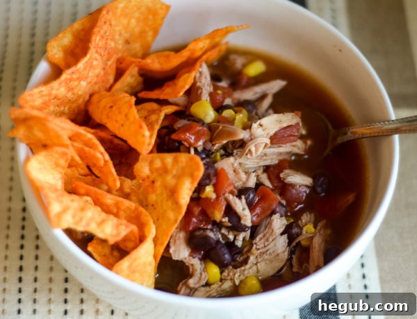 Effortless Slow Cooker Chicken Taco Soup 4 slow cooker chicken taco soup served with toppings