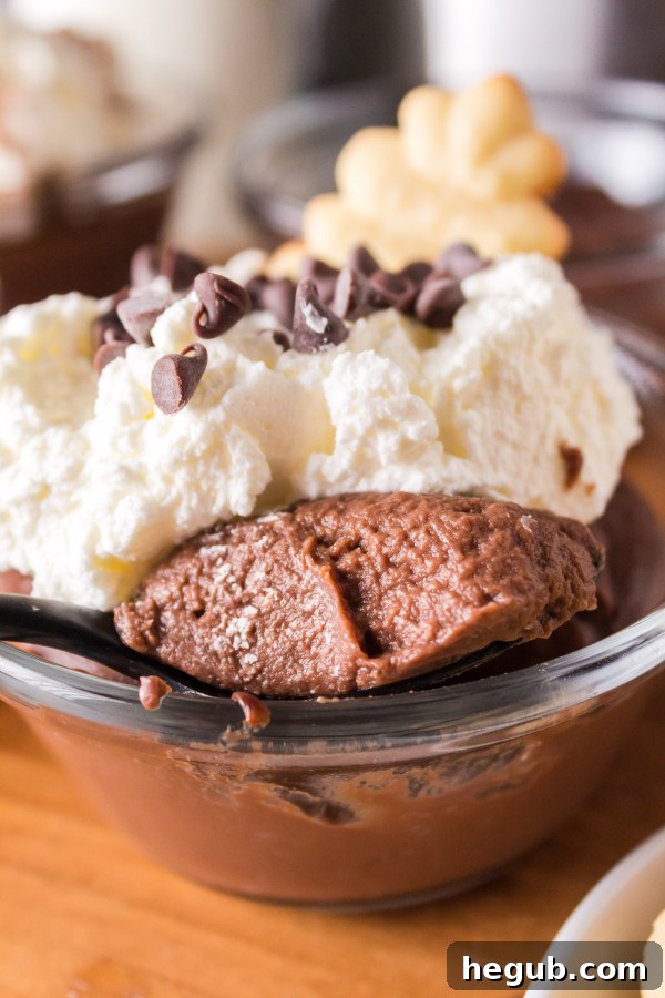 Close-up of creamy pressure cooker chocolate pudding in a glass jar.